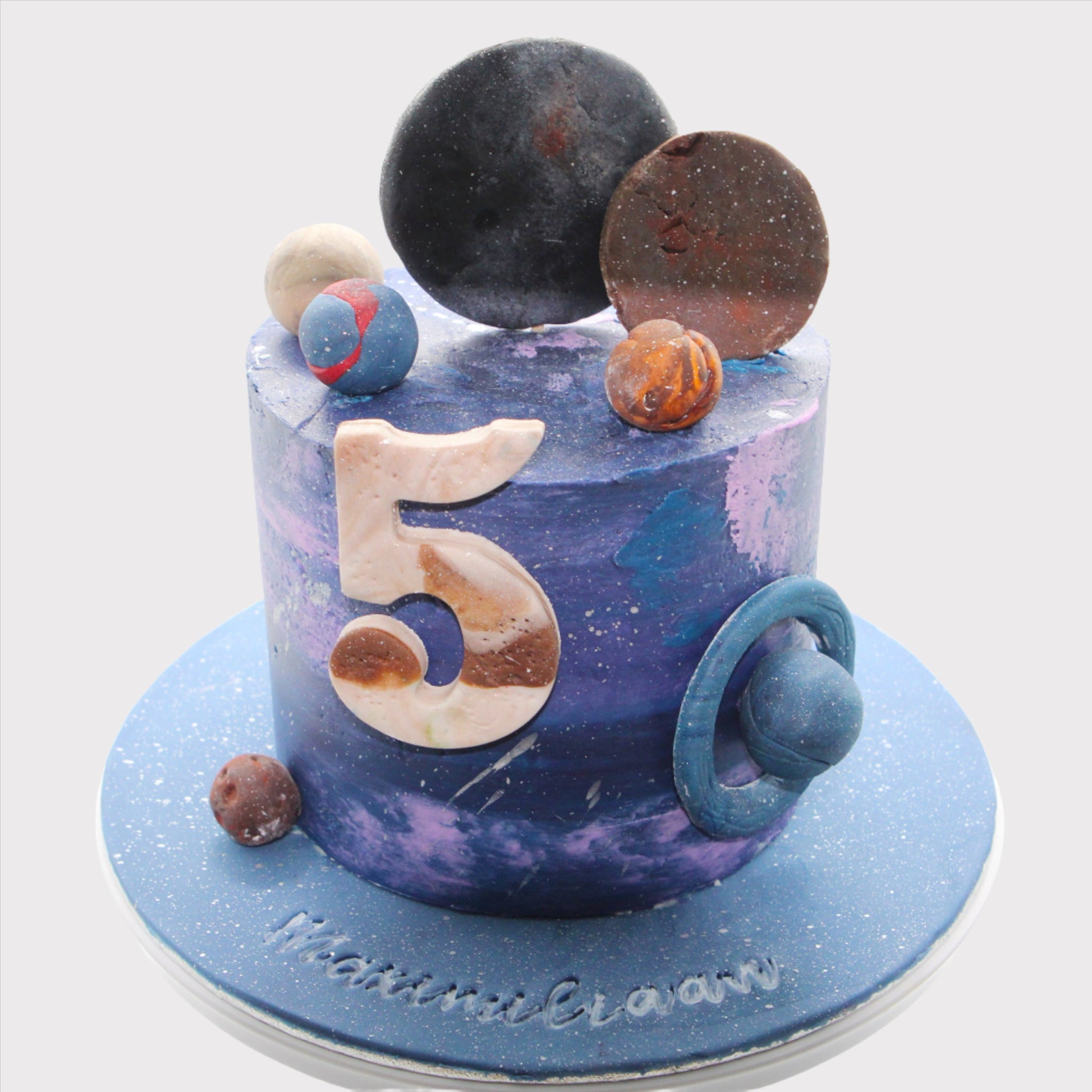 Galaxy verjaardagstaart met leeftijdscijfer en ruimte thema decoratie

